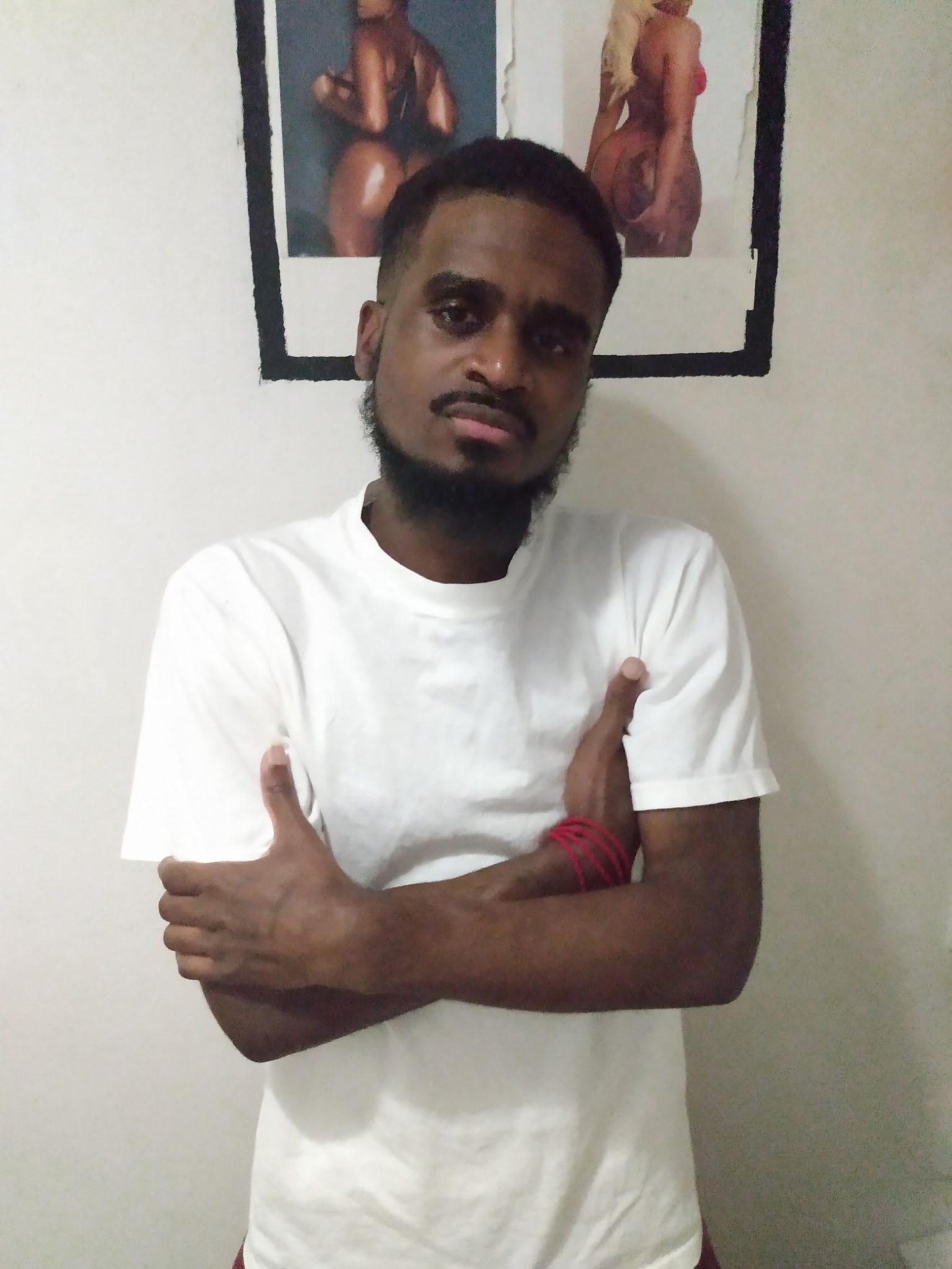 Portrait of Javon “Baby Jay” Arrington, a young Black man, smiling in a casual selfie. His loved ones are calling for an end to chemical torture and sexual humiliation against him at Red Onion State Prison.